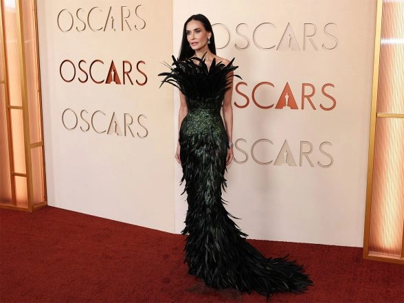 Entertainment News | Oscars: Demi Moore Steals Attention in Peacock Feathered Gown