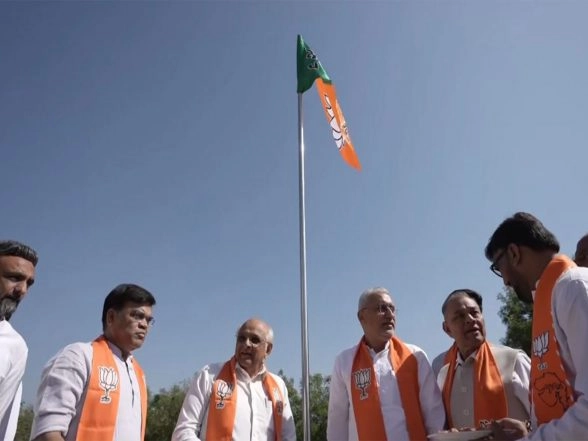 India News | Gujarat: CM Patel Along with Workers Hoist BJP Flag in Gandhinagar on Party's Foundation Day