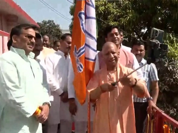 India News | Uttar Pradesh CM Yogi Hoists BJP Flag at Gorakhnath Temple on 47th Foundation Day in Gorakhpur