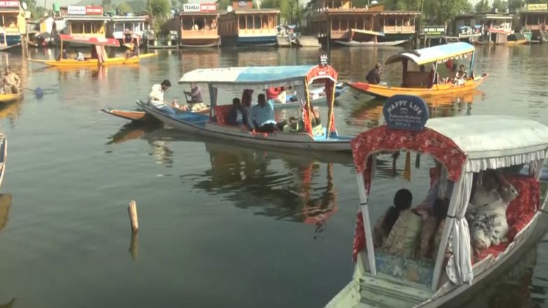 India News | Tourists Flock to Kashmir: Dal Lake's Serenity and Cool Climate Draw Visitors in Large Numbers