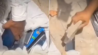 Viral Video Shows Villagers Destroying Smartphones With Bricks, Sparks Debate on Digital Addiction