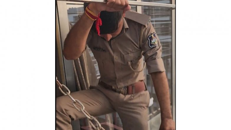 India News | Gujarat: Heroic Surat Cop Climbs Exterior Grille on Seventh Floor to Rescue Man