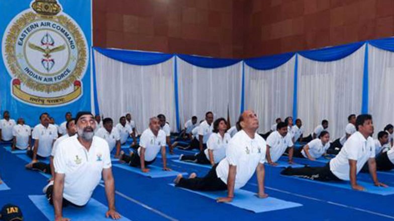 India News | International Day of Yoga 2026: Defence Minister Rajnath Singh Performs Yoga with Around 1,000 Soldiers at Eastern Air Command HQs in Shillong
