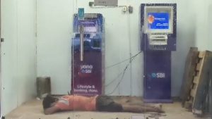 social-viral-Viral Video: Man Caught Sleeping Inside SBI ATM in UP’s Mau To Escape Heat