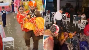 social-viral-Indore Viral Video: Groom Carries Bride Through Flooded Wedding Venue As Heavy Rain Inundates Marriage Garden