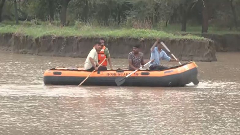 India News | MP: Labourer Swept Away While Crossing Flooded Culvert in Indore, Search on