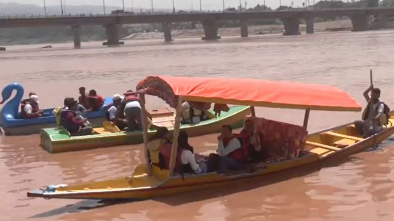 India News | Jammu and Kashmir: JMC Launches Boating Service at Tawi Riverfront for Amarnath Pilgrims, Tourists