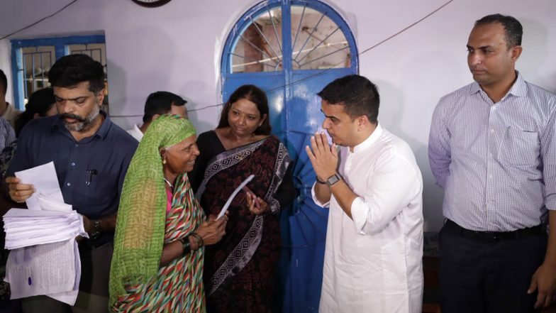 India News | Gujarat Dy CM Harsh Sanghavi Distributes Financial Assistance to Flood-affected Families in Surat