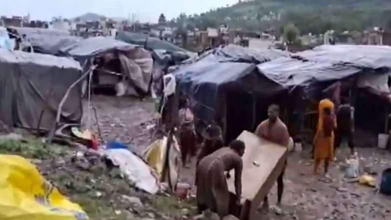 India News | Floodwaters Inundate New Bus Stand Area in J-K's Rajouri, Several Vehicles Washed Away