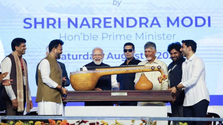 India News | PM Modi Receives Handcrafted Bobbili Ekanda Veena During Bhogapuram Airport Inauguration; Lauds Andhra Pradesh Artisans
