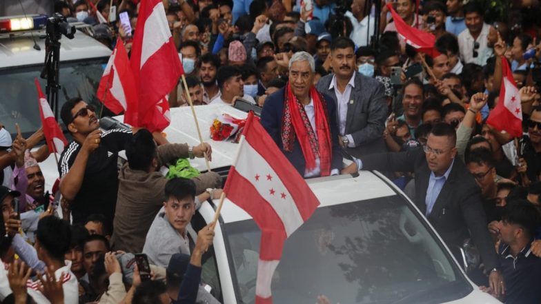 World News | Nepal's Ex-PM Deuba, Beaten in Gen-Z Protest, Returns After Months Abroad for Treatment, Receives Grand Welcome