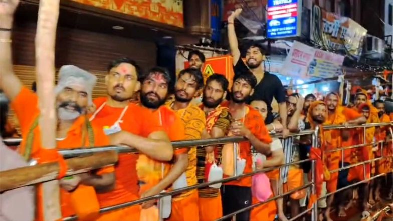 India News | UP: Kanwariyas Throng Kashi Vishwanath Dham on Third Monday of Sawan