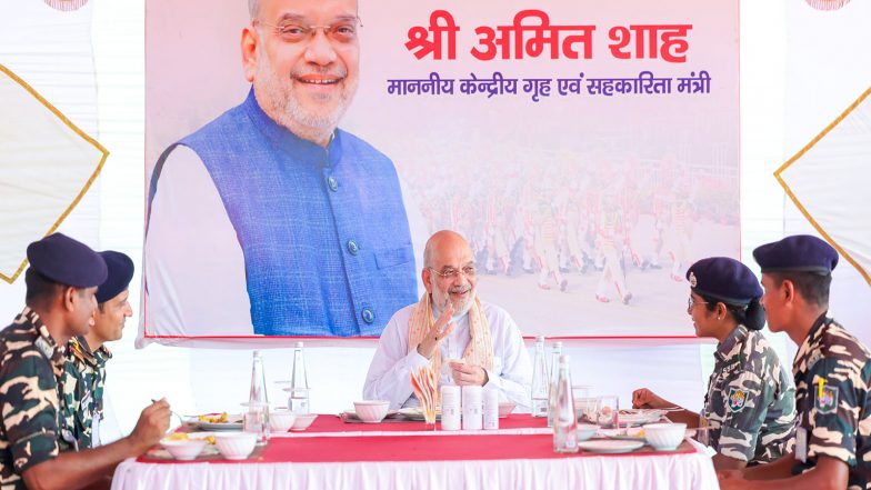 India News | West Bengal: Amit Shah Joins Sashastra Seema Bal Personnel for 'Bada Khana' Tradition in Siliguri