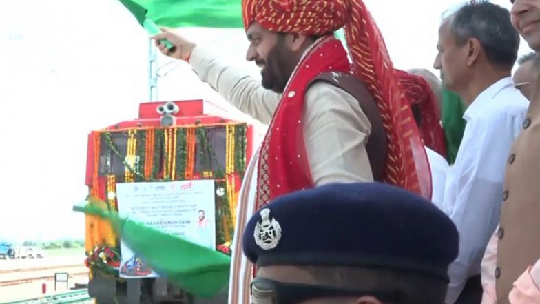 India News | Haryana CM Flags off First Goods Train from Rail Yard at Integrated Multi Modal Logistics Hub in Mahendragarh District