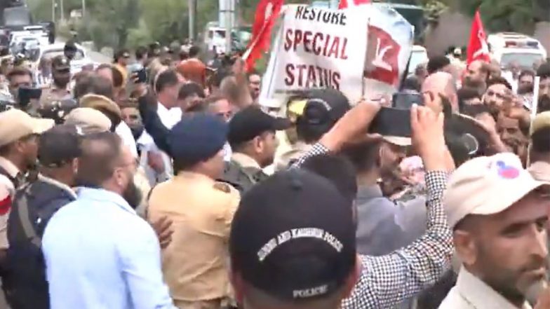 India News | J-K: NC Leaders Protest Near BJP Office in Srinagar, Demand Restoration of Statehood