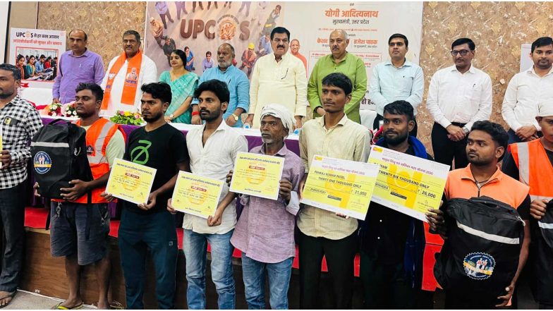 India News | Symbolic Checks Distributed to Outsourced Workers Under BOCW Schemes in Varanasi Following UPCOS Launch