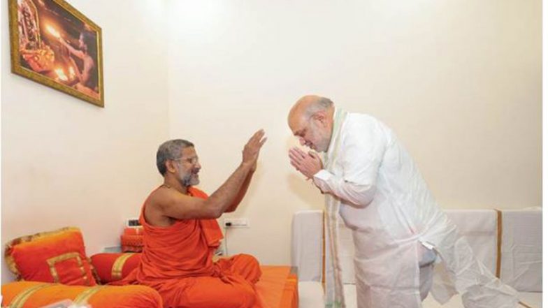 India News | Union Home Minister Amit Shah Meets Pejawar Mutt Seer Sri Vishwaprasanna Teerth Swamiji in Delhi
