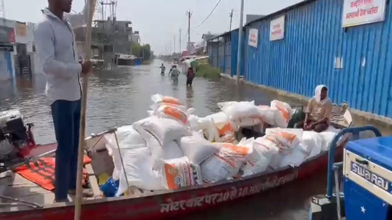 India News | Uttar Pradesh: Boats Deployed to Deliver Food Kits to Families Trapped in Waterlogged Localities in Lucknow