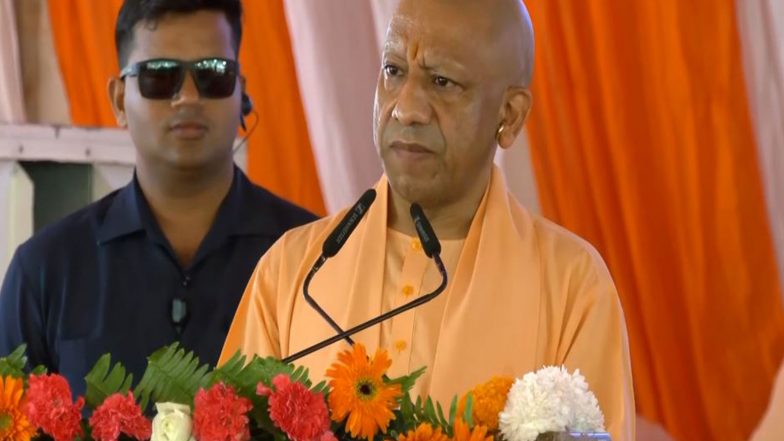 India News | CM Yogi Adityanath Hails PM Modi on 25 Years as Head of Govt, Says He Presented Gujarat as Model State