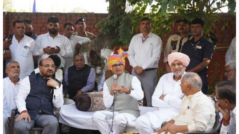 India News | Shivraj Singh Chouhan Interacts with Farmers at Kisan Chaupal in Haryana’s Karnal, Calls for Balanced Fertiliser Use and Natural Farming